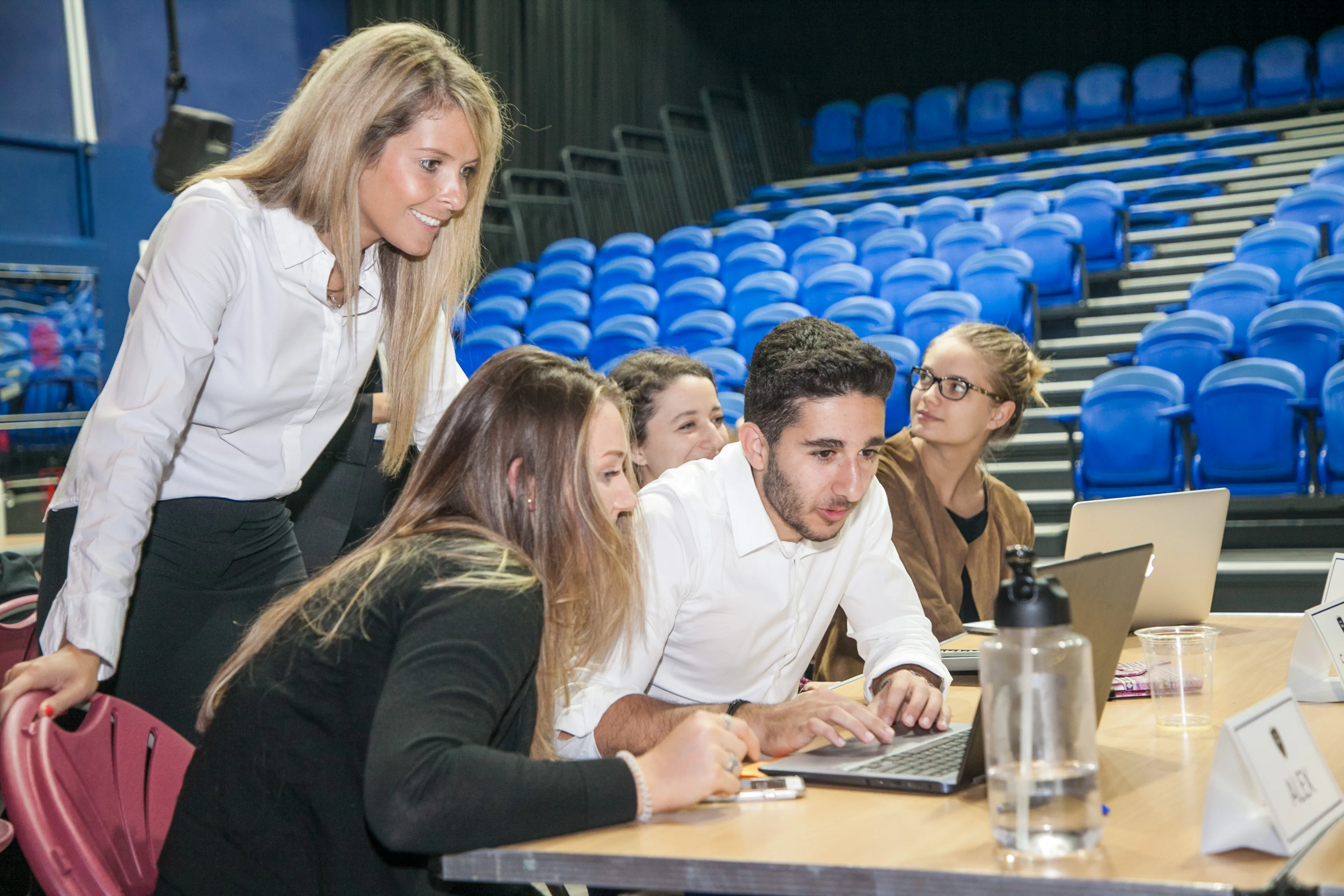 Katherine helping students collaborate on a business project